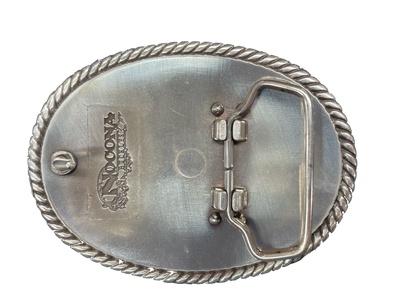 This oval shaped buckle by Nocona has a rope design around the border. It is chrome colored with scroll design etched appearance on surface.  Measures 2 3/4" tall by 3 3/4" wide and fits belts up to 1 1/2" wide.  It is available for purchase in our retail shop in Smyrna, TN, just outside Nashville and also on our online store. Made in Taiwan. Back of buckle pictured.