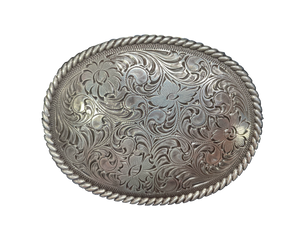 This oval shaped buckle by Nocona has a rope design around the border. It is chrome colored with scroll design etched appearance on surface.  Measures 2 3/4" tall by 3 3/4" wide and fits belts up to 1 1/2" wide.  It is available for purchase in our retail shop in Smyrna, TN, just outside Nashville and also on our online store. Made in Taiwan.