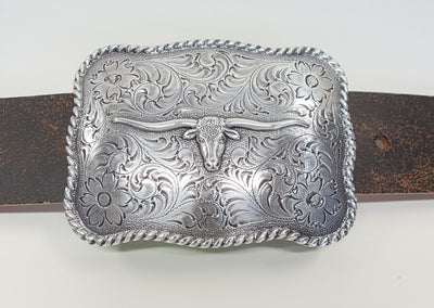 Nocona Western buckle with longhorn steer design Dimensions 2 3/4" tall by 3 3/4" wide Great for accentuating the Western look of your wardrobe Available online and in our shop in Smyrna, TN, just outside of Nashville