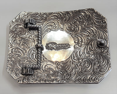 Nocona Western buckle with longhorn steer design Dimensions 2 3/4" tall by 3 3/4" wide Great for accentuating the Western look of your wardrobe Available online and in our shop in Smyrna, TN, just outside of Nashville. back of buckle pictured