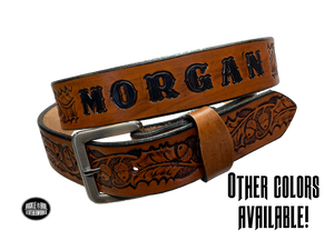 The Tall Oak Name Leather Belt is crafted from strong, high-quality Veg tan leather with an embossed Oak and Acorn pattern. Choose your finish and a name if desired. Its solid Antique nickel brass buckle is easy to change with included snaps, perfect for everyday wear. Handmade outside of Nashville in Smyrna, TN.