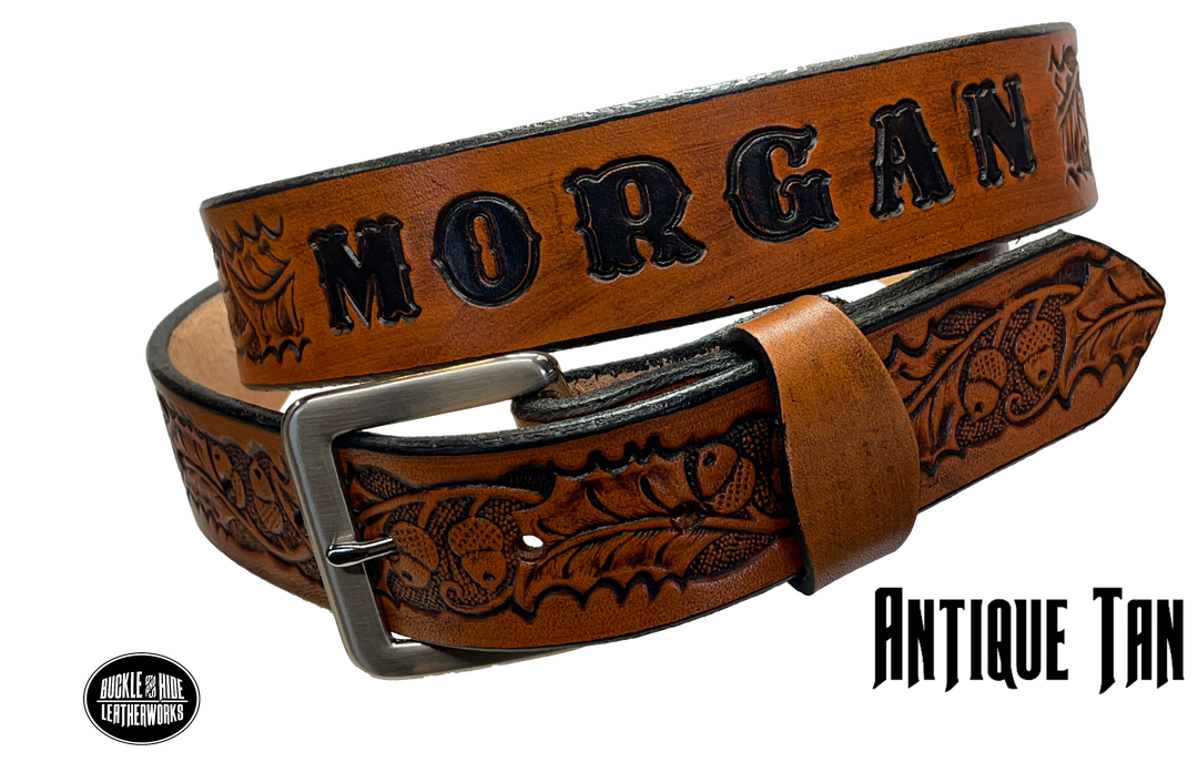 The Tall Oak Name Leather Belt is crafted from strong, high-quality Veg tan leather with an embossed Oak and Acorn pattern. Choose your finish and a name if desired. Its solid Antique nickel brass buckle is easy to change with included snaps, perfect for everyday wear. Handmade outside of Nashville in Smyrna, TN.
