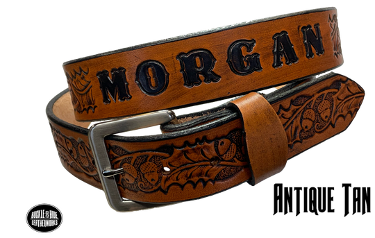 The Tall Oak Name Leather Belt is crafted from strong, high-quality Veg tan leather with an embossed Oak and Acorn pattern. Choose your finish and a name if desired. Its solid Antique nickel brass buckle is easy to change with included snaps, perfect for everyday wear. Handmade outside of Nashville in Smyrna, TN.