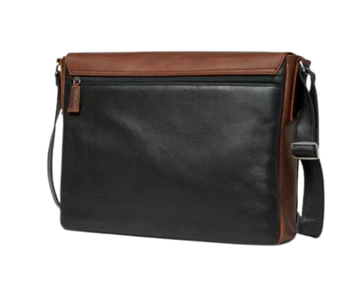 This leather messenger bag is made from soft real cowhide leather.  Flap is distressed brown leather and body has contrasting darker brown or black colored leather. The flap secures with a magnetic snap. Dimensions are approx. 15" by 12" by 3". Back pocket will hold a full size laptop.  Inner bag is lined with nylon and leather trim and hardware is brushed nickel. Available for purchase in our retail shop in Smyrna, TN, just outside Nashville.