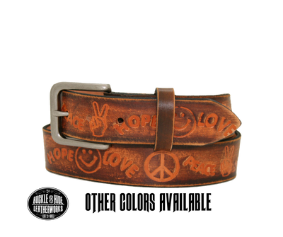 Made in our Smyrna, TN, USA shop Hand dyed and distressed brown USA veg-tan cowhide approx. 1/8" thick Embossed with Peace Hope Love design Antique Silver finish buckle snaps in place for easy changing if desired Belt looks worn, hand finished distressed look-new leather will soften with use (like a pair of quality leather boots) Full grain American vegetable tanned cowhide Width 1 1/2" Available in sizes 34" to 46".