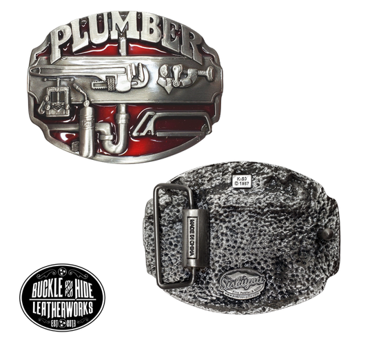 The Plumbers buckle part of our First Responders and Trades series we've added. Bless our men and women who build buildings and homes we live in. They get up early and go to work! The pipe wrenches and tools on a slightly oval shaped belt buckle. Pewter belt buckle that may be attached to your belt.  Fits 1 1/2" belts, Size 3-1/2" x 2-3/4. Available online and in our shop just outside Nashville in Smyrna, TN.