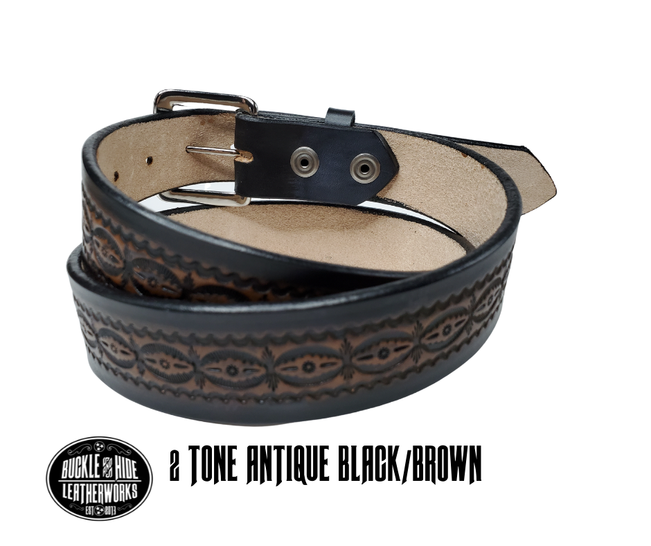 This handmade real leather belt is made from black, drum dyed cowhide shoulder that is 8-9 oz. or approx. 1/8" thick.  It is 1 1/2" wide and has a vintage design embossed on the surface with smoothed and burnished edges. The antique nickel plated solid brass buckle is snapped in place. Made just outside Nashville, in Smyrna, TN, you will find it is one of the longest lasting belts you will own.  It is made from a single strip of leather and is perfect for either casual or dress w