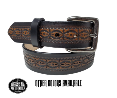 This handmade real leather belt is made from black, drum dyed cowhide shoulder that is 8-9 oz. or approx. 1/8" thick.  It is 1 1/2" wide and has a vintage design embossed on the surface with smoothed and burnished edges. The antique nickel plated solid brass buckle is snapped in place. Made just outside Nashville, in Smyrna, TN, you will find it is one of the longest lasting belts you will own.  It is made from a single strip of leather and is perfect for either casual or dress w