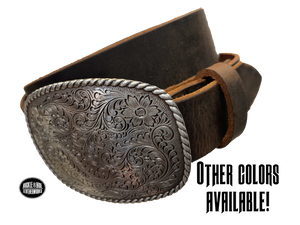 This rectangular shaped buckle by Nocona has rounded edges with rope design around the border. It is chrome colored with scroll design etched appearance on surface.  Measures 2 3/4" tall by 3 3/4" wide and fits belts up to 1 1/2" wide. Buckle is made in Taiwan. Belt is a single strip of leather that is 1 1/2" wide and available in sizes 34" to 44". Colors are distressed brown, black, and dark brown. Available online and in our shop in Smyrna, TN, just outside Nashville.