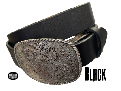 This rectangular shaped buckle by Nocona has rounded edges with rope design around the border. It is chrome colored with scroll design etched appearance on surface.  Measures 2 3/4" tall by 3 3/4" wide and fits belts up to 1 1/2" wide. Buckle is made in Taiwan. Belt is a single strip of leather that is 1 1/2" wide and available in sizes 34" to 44". Colors are distressed brown, black, and dark brown. Black pictured. Available online and in our retail shop in Smyrna, TN, just outside Nashville.