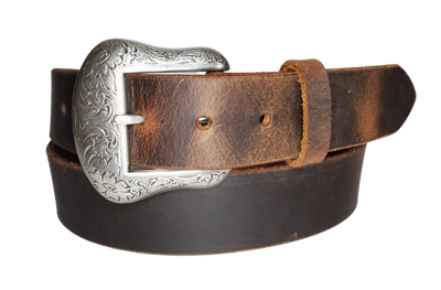 "The Sheridan" named after the well known town in Wyoming. The buckle has a Western Scroll pattern in a antique silver color that is right at home on the Ranch or Downtown, Belt is a solid strip of leather and made in our shop in Smyrna, TN, just outside of Nashville. Belt is 1 1/2" wide, choose from either distressed brown, black, or chocolate brown. Sizes available from 34"-44". Buckle is imported. Available in our retail and online shops.