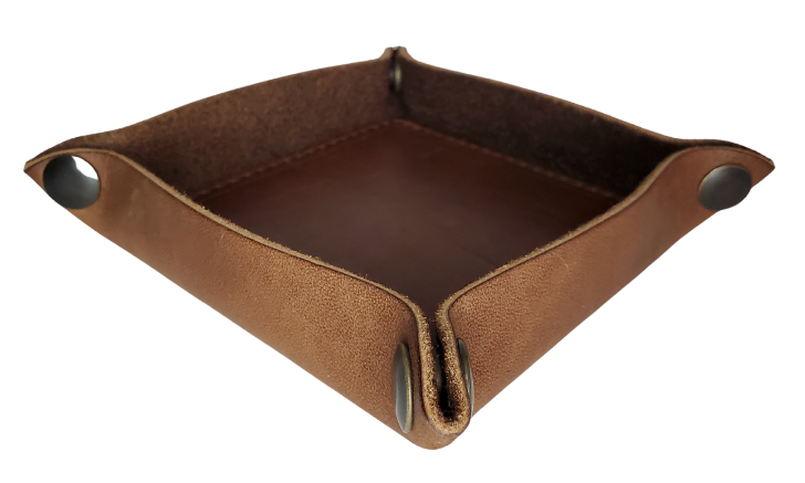 Make it PERSONAL! This handmade real leather valet tray can be personalized with up to 8-10 letters. It has Antique Brass SNAPPED corners to FLATTEN out for easy packing for travel. It is made in our Smyrna, TN shop just outside Nashville. It is a perfect catch-all for keeping keys and other small items in one place at the end of a long day. Makes a great gift for groomsmen, or that special someone.

Med. Approx. 7"x 7" (snapped)
Small Approx. 4.5"x 4.5" (snapped)