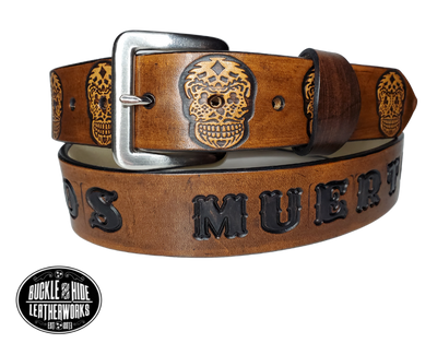 "The Calavera" is a handmade real leather belt made from a single strip of cowhide shoulder leather that is 8-10 oz. or approx. 1/8" thick. It has hand burnished (smoothed) edges and a Sugar Skull pattern. This belt is completely HAND dyed with a multi step finishing technic or basic Earth tones. The antique nickel plated solid brass buckle is snapped in place with heavy snaps.  This belt is made just outside Nashville in Smyrna, TN.