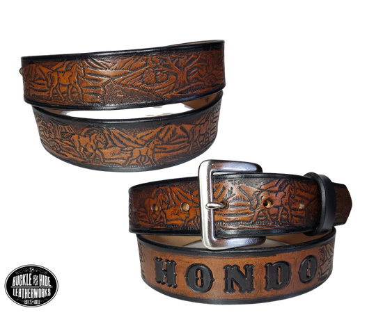 "The Stallion" is a handmade real leather belt made from a single strip of cowhide shoulder leather that is 8-10 oz. or approx. 1/8" thick. It has hand burnished (smoothed) edges and a Wild Horse scene embossed pattern down the center. This belt is completely HAND dyed with a multi step finishing technic. The antique nickel plated solid brass buckle is snapped in place with heavy snaps.  This belt is made just outside Nashville in Smyrna, TN.