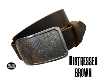 Rectangular antique silver belt buckle with western style tooling, size approx. 3" wide by 2 1/2" tall. Belt is handmade from a single strip of leather in our shop. Belt colors available are distressed brown, black, and dark brown. Buckle snaps in place for easy changing if desired.﻿ CHOOSE ONE BELT STRIP COLOR! Available online and at our shop just outside Nashville in Smyrna, TN.