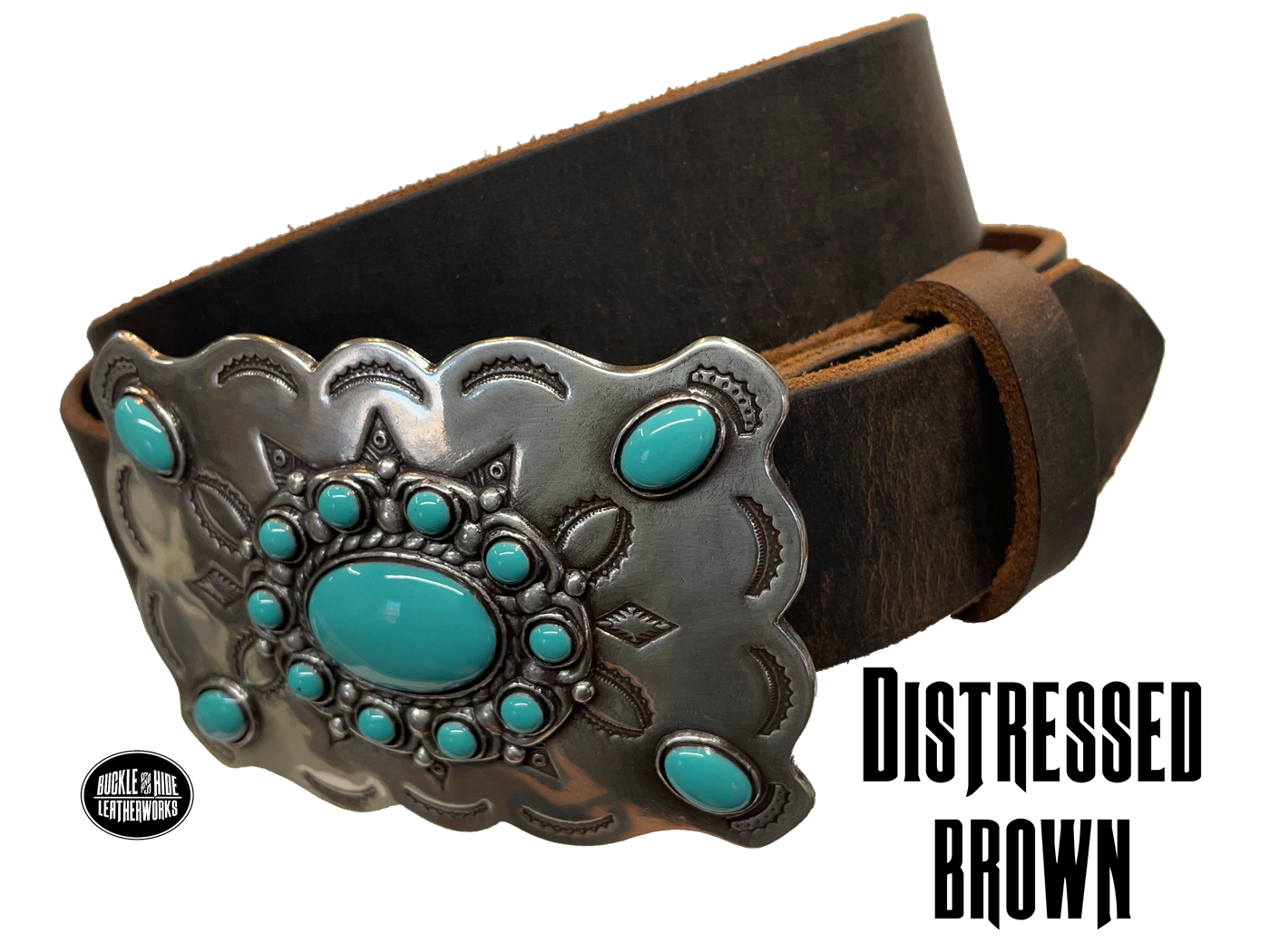 Southwestern style belt buckle with Southwestern tooling, scalloped design around edges, and simulated turquoise stones, approx. size 3 1/2" wide by 2 1/2" tall.  Color is antique silver, buckle is made of zinc. Fits belts 1 1/2" wide. Belt is handmade from a single strip of leather, choose from either distressed brown, black, or dark brown. CHOOSE ONE BELT STRIP COLOR! Available online and in our shop just outside Nashville in Smyrna, TN. Distressed brown belt.