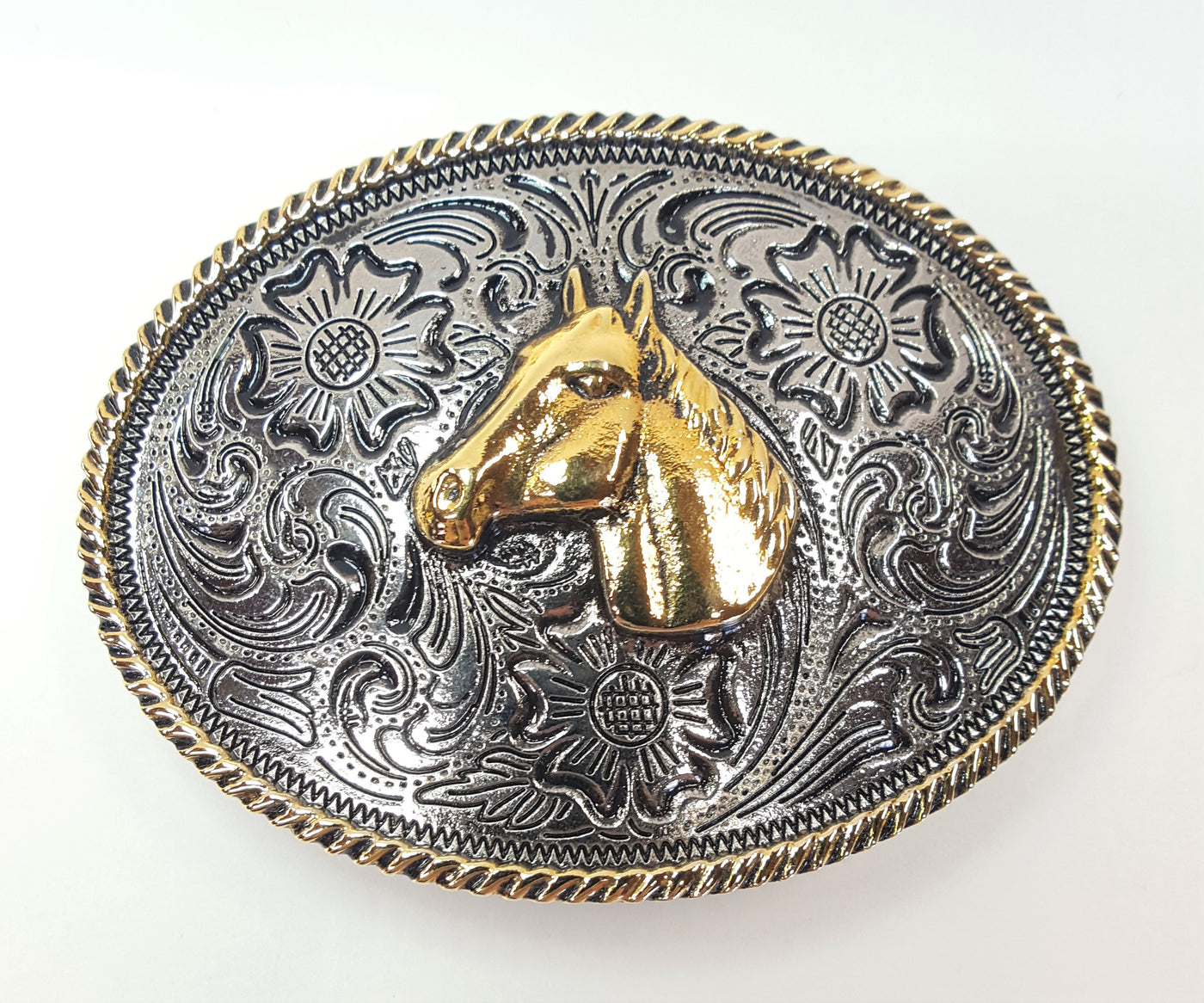 Horsehead buckle by AndWest pictures a chrome colored background with Western scroll and flowered pattern.  Edge of the oval buckle has gold colored rope pattern along the edge and horse head is gold colored and centered on buckle. Works great for child's belt or adult who wants a smaller buckle Fits belt widths up to 1 1/4" Dimensions are 2 3/8" tall by 3 1/4" wide Available in our online store and also in the retail shop in Smyrna, TN, just outside of Nashville.