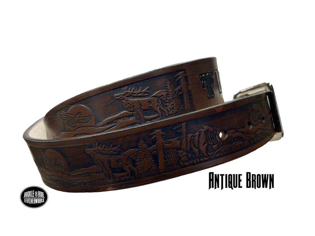 Take a trip to the majestic Colorado Rockies with this unique Name belt with elk, Bear, and Eagle Veg-tan leather approx. 1/8" thick. Hand finished in 3 color options and includes tasteful brass buckle. Easy buckle change with snaps, you'll be ready for every adventure! made in our Smyrna, TN shop just outside Nashville.