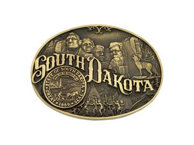 Small, oval cast brass Attitude belt buckle with polished wire trim. Large lettering spelling out South Dakota stretches boldly across, surrounded by a set of antiqued figures in celebration of South Dakota heritage including Mount Rushmore, Native American dancers and the state seal. Buckles are acid washed to add the dark antiqued patina and hand buffed to bring out the highlights and details.  Standard 1.5" belt swivel. Available online and in our shop in Smyrna, TN, just outside of Nashville.