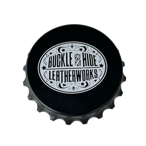 Black "Bottle Cap shaped" Magnetic bottle opener with white Buckle and Hide Oval logo. Available online or in our shop just outside Nashville in Smyrna, TN.