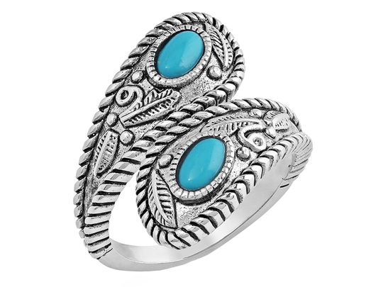 Open ring that is antiqued-silver in color and wraps around the finger to overlap. The twists and curls of the silver are accented by etched florals and filigree. The ends are teardrop in shape and hold a turquoise stone in the middle. Stone color and shape may vary. Available online or at our shop just outside Nashville in Smyrna, TN. Size is adjustable.

Material: Rhodium over a sterling silver base. Synthetic turquoise. Dimensions: 0.78"W x 0.15"H