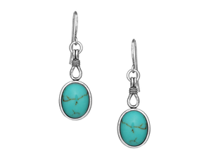 Turquoise oval earrings that are held together with a silver rope detail. They dangle from your ear on hypoallergenic French stainless steel hooks. Rhodium over a brass base. Stainless steel French wires. Turquoise. Available online or at our shop just outside Nashville in Smyrna, TN. 