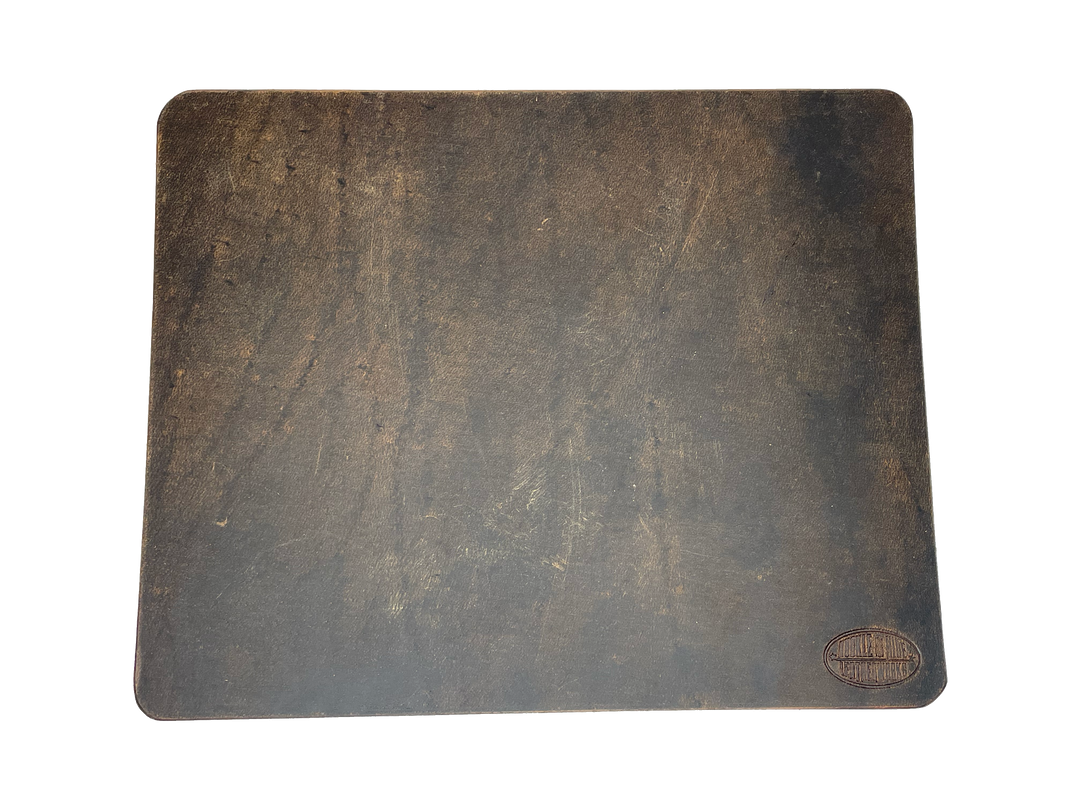 This heavy Bridle leather mouse pad with hand burnished smooth edges and is approx. 1/8" thick. Size is 8" x 10".  This size gives you plenty of room to mouse around! May choose plain or with 1-3 initials stamped in lower left corner with our logo stamped in the lower right corner. Made in our shop just outside Nashville in Smyrna, TN.