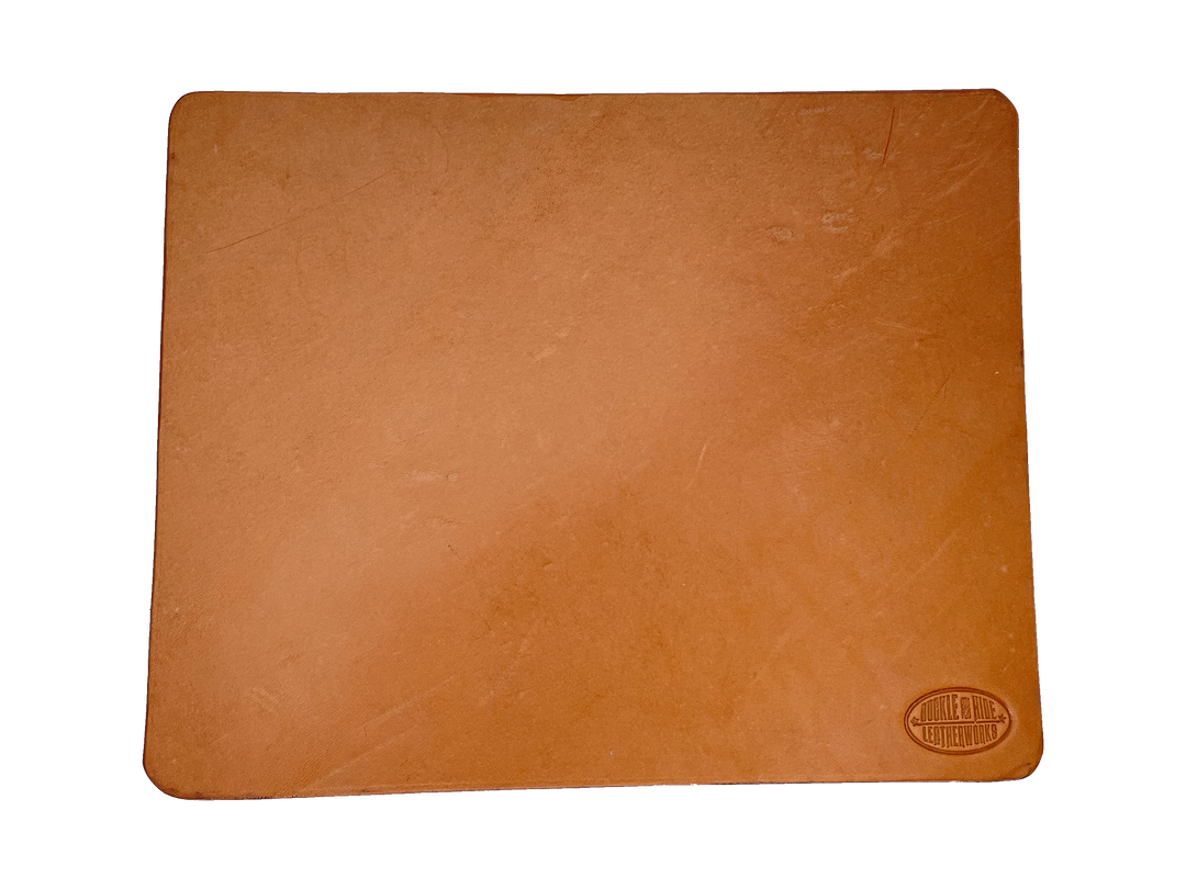 This heavy Bridle leather mouse pad with hand burnished smooth edges and is approx. 1/8" thick. Size is 8" x 10".  This size gives you plenty of room to mouse around! May choose plain or with 1-3 initials stamped in lower left corner with our logo stamped in the lower right corner. Made in our shop just outside Nashville in Smyrna, TN.