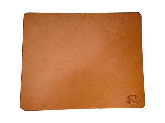 This heavy Bridle leather mouse pad with hand burnished smooth edges and is approx. 1/8" thick. Size is 8" x 10".  This size gives you plenty of room to mouse around! May choose plain or with 1-3 initials stamped in lower left corner with our logo stamped in the lower right corner. Made in our shop just outside Nashville in Smyrna, TN.