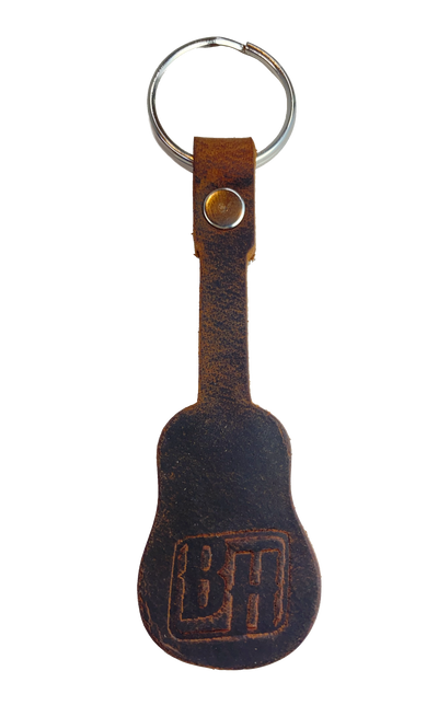 Handmade Brown distressed leather keychain in the shape of a guitar embossed with Buckle and Hide "B&H" logo. BUY MORE and SAVE! Made in our shop in Smyrna, TN, just outside Nashville. Key ring is split ring and leather is attached with a single rivet.