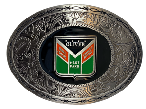Metal oval buckle with barbed wire and western tooling and Oliver logo in the center. Available online and in our shop just outside Nashville in Smyrna, TN.