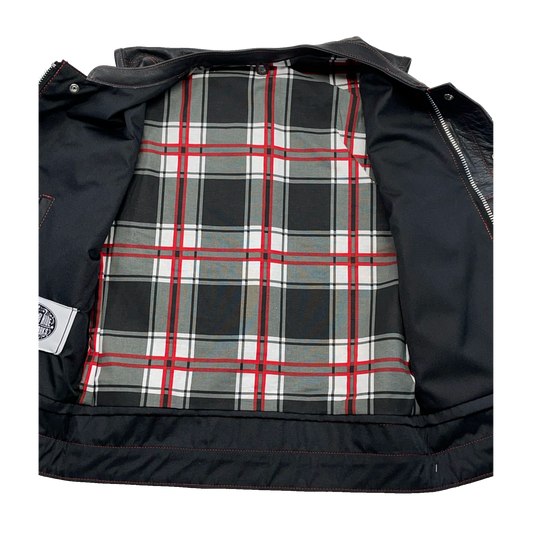 The Jackson Red is a black riding vest made from premium naked cowhide leather. It has CONTRASTED RED STITCHING, and PLAID FLANNEL LINING of black, red, and white. It features: a tab style collar, snap front and zippered closure, solid panel back, two lower front snap pockets, front chest snap pockets, and inside conceal carry pockets on each side. Available in our Smyrna, TN shop just outside of Nashville. Sizes available from Small to 6XL.