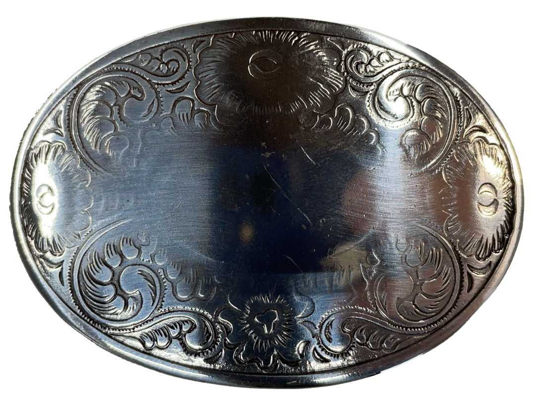 Oval shaped antique silver colored belt buckle with western style tooling, Smaller size approx. 3"wide by 2" tall. Available online and at our shop just outside Nashville in Smyrna, TN. Buckle is imported and made from zinc.