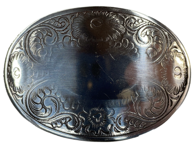 Oval shaped antique silver belt buckle with western style tooling, size approx. 2 3/8" wide by 2" tall. Available online and at our shop just outside Nashville in Smyrna, TN.