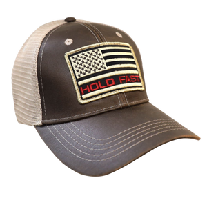 Hold fast to faith, family, and freedom in this rugged “Flag Red & Tan” Cap in Brown/Tan by HOLD FAST®. Hold fast to your faith, your family, and your freedom. We can celebrate these things because of the sacrifice of those who serve in the United States Armed Forces, and ultimately because of the sacrifice of our Lord and Savior, Jesus Christ, on the cross at Calvary.  Available online or in our shop just outside Nashville in Smyrna, TN.