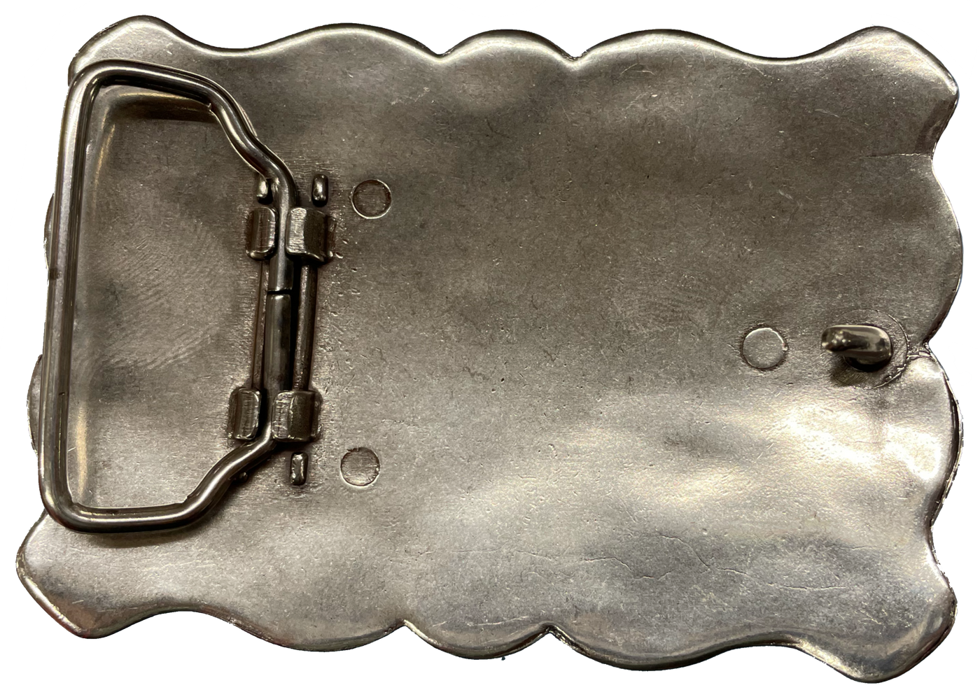 Southwestern style belt buckle with Southwestern tooling, scalloped design around edges, and simulated turquoise stones, approx. size 3 1/2" wide by 2 1/2" tall.  Color is antique silver, buckle is made of zinc. Fits belts 1 1/2" wide. Available online and in our shop just outside Nashville in Smyrna, TN. Back of buckle is pictured.