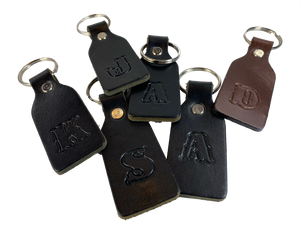 Small Leather keychain embossed with your choice of single letter initial. Great for identifying luggage, backpacks, or you keys! Available in Black or Assorted Brown. Put initial/s in the box. Made in our Smyrna Tn. shop.