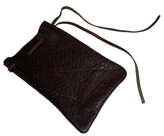 Leather pouch with drawstring. Available in Black and Assorted Brown. Fill it with anything you like, a camera, your rock collection, tools etc. This large leather pouch can be used to hold a small canteen or flask. Made in USA.