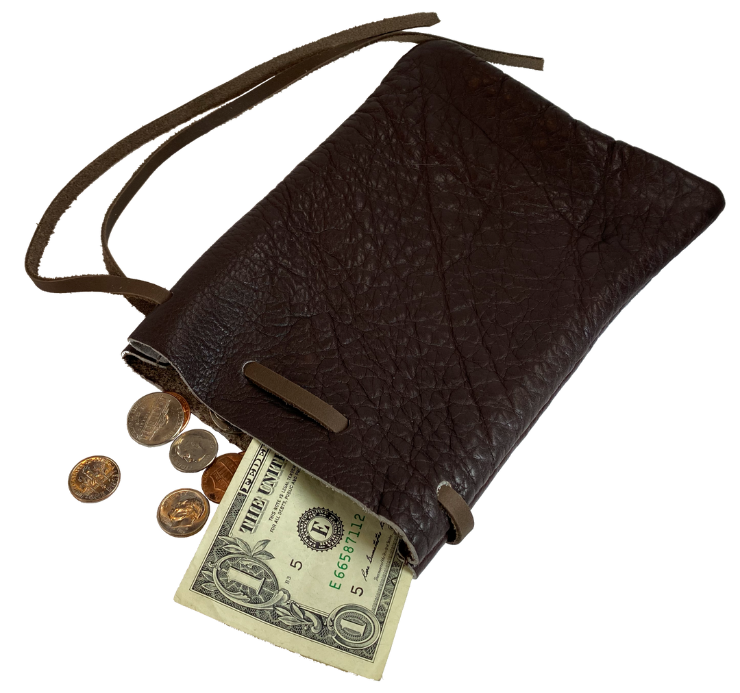 Leather pouch with drawstring. Available in Black and Assorted Brown. Fill it with anything you like, a camera, your rock collection, tools etc. This large leather pouch can be used to hold a small canteen or flask. Made in USA.