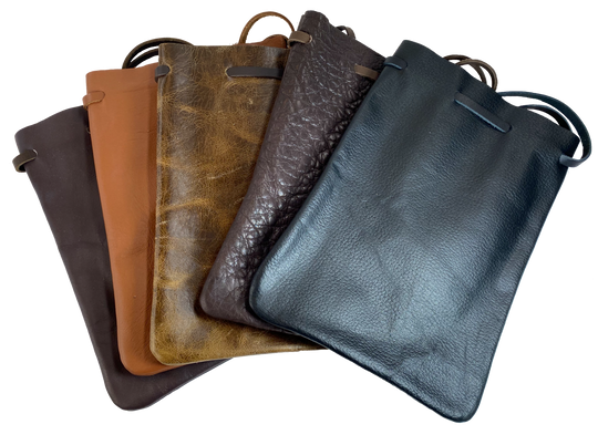 Leather pouch with drawstring. Available in Black and Assorted Brown. Fill it with anything you like, a camera, your rock collection, tools etc. This large leather pouch can be used to hold a small canteen or flask. Made in USA.