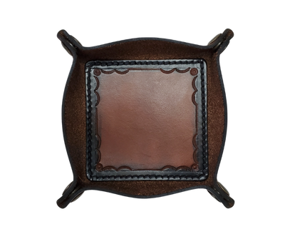 This Valet is different than our Gulch tray because of the HAND SATAMPED border design with Hand Finishing done on the VEG -TAN inside. Antique Brass SNAPPED corners to FLATTEN out for easy packing for travel. It is made in our Smyrna, TN shop just outside Nashville.  The Stitched inside leather matches the outside for rustic look. It is a perfect catch-all for keeping keys and other small items in one place at the end of a long day.  Makes a great gift for groomsmen, or that special someone.