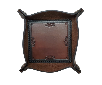 This Valet is different than our Gulch tray because of the HAND SATAMPED border design with Hand Finishing done on the VEG -TAN inside. Antique Brass SNAPPED corners to FLATTEN out for easy packing for travel. It is made in our Smyrna, TN shop just outside Nashville.  The Stitched inside leather matches the outside for rustic look. It is a perfect catch-all for keeping keys and other small items in one place at the end of a long day.  Makes a great gift for groomsmen, or that special someone.