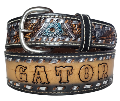 The Honky Tonk leather belt is a classic Vintage Throwback Style Western belt. Complete with silver Buck Stitching and a embossed eagle design in Black/Silver/Blue coloring. Available in a 1 1/2" width tapering up to 1 3/4" wide. Full grain vegetable tanned cowhide, Width 1 1/2" and includes Nickle plated  buckle Smooth burnished painted edges. Made in USA!   In stock at our Smyrna, TN shop.