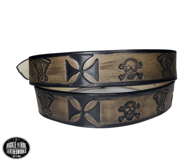 "The Hardtail" is a handmade real leather belt made from a single strip of cowhide shoulder leather that is 8-10 oz. or approx. 1/8" thick. It has hand burnished (smoothed) edges and features a V-twin engine, Skull and Crossbones and Maltese style cross pattern down the center. This belt is completely HAND dyed with a multi step finishing technic. The antique nickel plated solid brass buckle is snapped in place with heavy snaps.  This belt is made just outside Nashville in Smyrna, TN.
