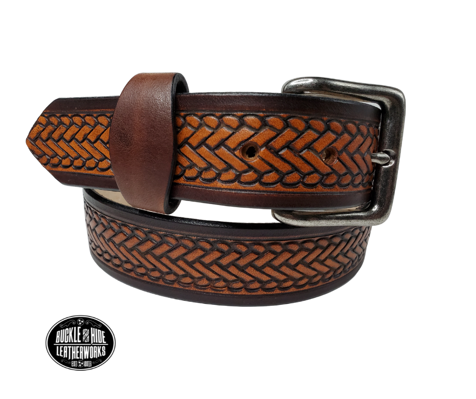 The West End handmade all leather belt is made from a single strip of Veg-Tan cowhide that is a hand finished Veg-tan that is 9-10 oz., or approx. 1/8" thick.  width  1 1/2".  It has an embossed design that is never out of style!  The antique nickel plated solid brass buckle is snapped in place. This belt is made just outside Nashville in Smyrna, TN. Perfect for casual and dress wear, it can be for personal use or for groomsman gifts or other gifts as well. 
