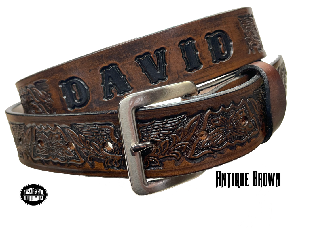 Our Patriot" Name Leather Belt is Full grain American vegetable tanned cowhide approx. 1/8"thick.&nbsp;Width 1 1/2" and includes Antique Nickle plated Solid Brass buckle. Hand Finished with Smooth burnished painted edges. Choose with or without name, if without name, design will cover entire length of belt. For name Type name desired on belt in "Type Name Here" section, no more than 10 letters maximum. Buckle snaps in place for easy changing if desired. Made in our Smyrna, TN, USA shop.