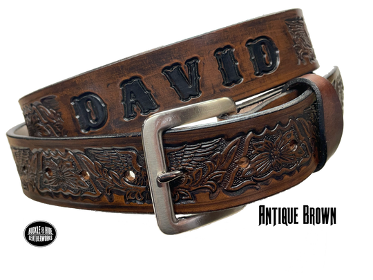 Our Patriot" Name Leather Belt is Full grain American vegetable tanned cowhide approx. 1/8"thick.&nbsp;Width 1 1/2" and includes Antique Nickle plated Solid Brass buckle. Hand Finished with Smooth burnished painted edges. Choose with or without name, if without name, design will cover entire length of belt. For name Type name desired on belt in "Type Name Here" section, no more than 10 letters maximum. Buckle snaps in place for easy changing if desired. Made in our Smyrna, TN, USA shop.
