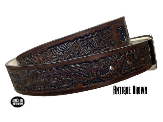 Our Patriot" Name Leather Belt is Full grain American vegetable tanned cowhide approx. 1/8"thick.&nbsp;Width 1 1/2" and includes Antique Nickle plated Solid Brass buckle. Hand Finished with Smooth burnished painted edges. Choose with or without name, if without name, design will cover entire length of belt. For name Type name desired on belt in "Type Name Here" section, no more than 10 letters maximum. Buckle snaps in place for easy changing if desired. Made in our Smyrna, TN, USA shop.