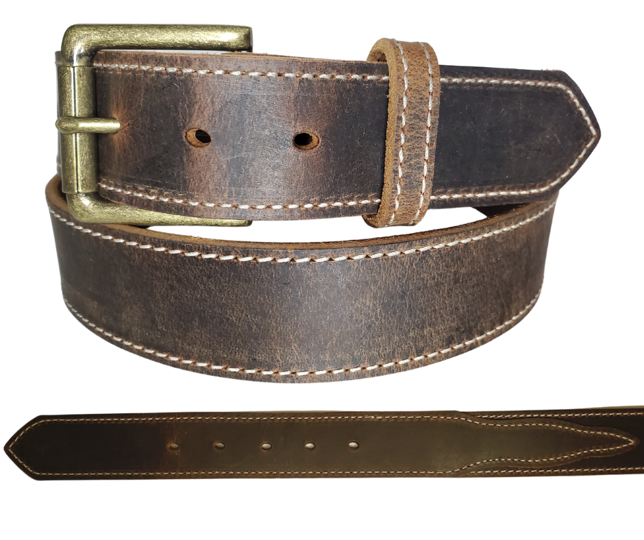 "The Chisholm Trail" is a real leather belt made from a single thick parts of cowhide shoulder leather that is 8-10 oz. or approx. 1/8" thick. It is assembled in 3 main sections 2 billets or end parts and the main center section.  The buckle is antique nickel plated and is snapped in place for easy buckle change.  This belt is stocked in our shop in Smyrna, TN just outside Nashville.