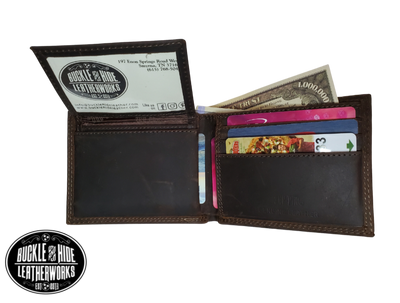 Distressed Brown bi-fold wallet with a Antique nickel oval concho with your choice of a Buck, Bass, or a Mallard duck Features... 2 large cash pockets, 3 card slots, 2 pockets under the card pockets, 2 slot I.D. holder that is "removeable" (see pic), also includes a clear card/picture sleeve  Ships in Tin gift box See our other wallets with your favorite College Sports teams